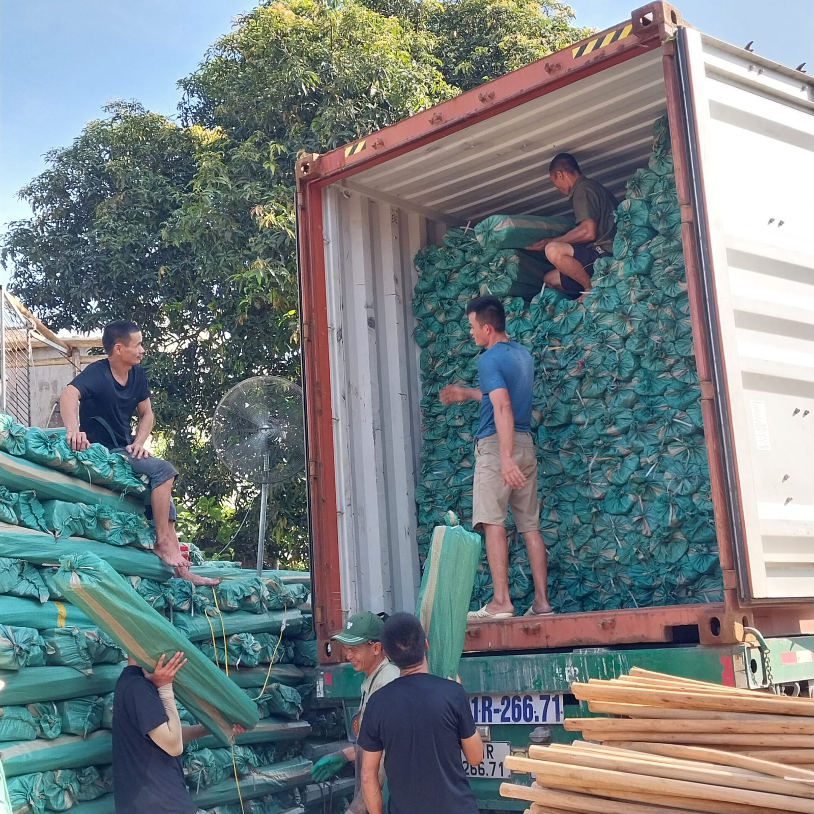 loading wooden broom handles